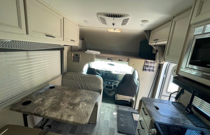 Living area, convertible dinette bed, can sleep one adult, upper bunk bed can sleep two adults