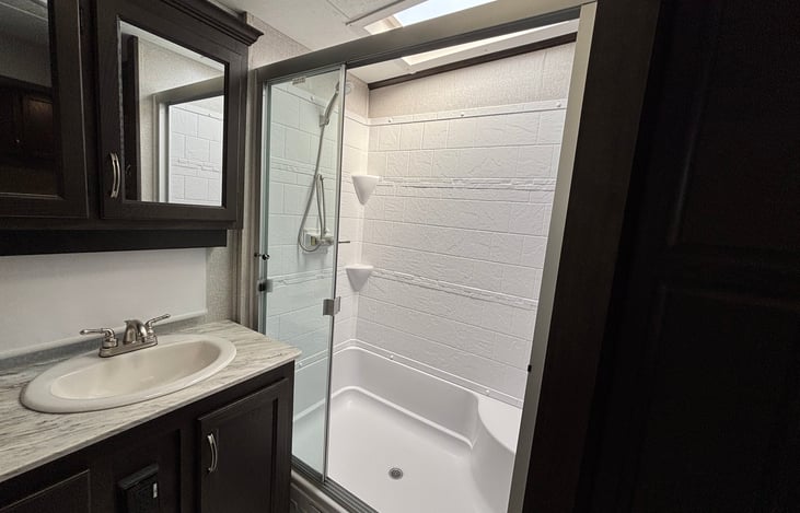 Full size shower with skylight