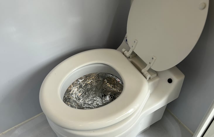 Laveo toilet with cartridges, no digging holes to bury your waste. Completely self contained, Google it, they work like a diaper genie.