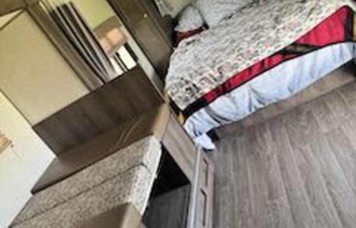 Dinette makes into a bed perfect for a little one! The queen bed has a comfortable mattress topper along with a privacy curtain! You won’t want to get out of bed!