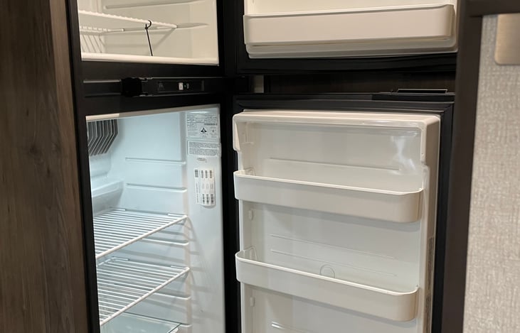 Separate freezer and fridge, runs on propane and electric.