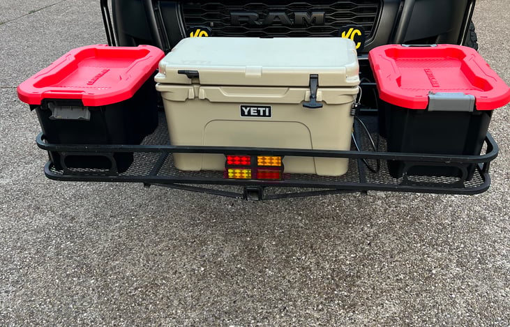 Outfitted with optional, add-on cargo rack mounted to front hitch (can also be mounted to rear hitch).