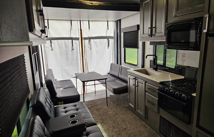 Queen sized Happy jack beds drop down and convert into a dining or gaming area; Table will be provided and can be folded up or moved outside giving you more room for relaxing or gatherings