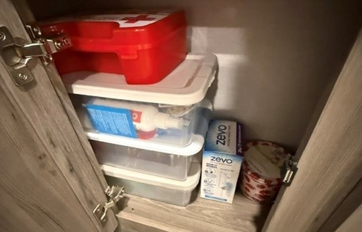 Entertainment Cabinet Storage 1. First Aid Kit, Bug Spray, ect.