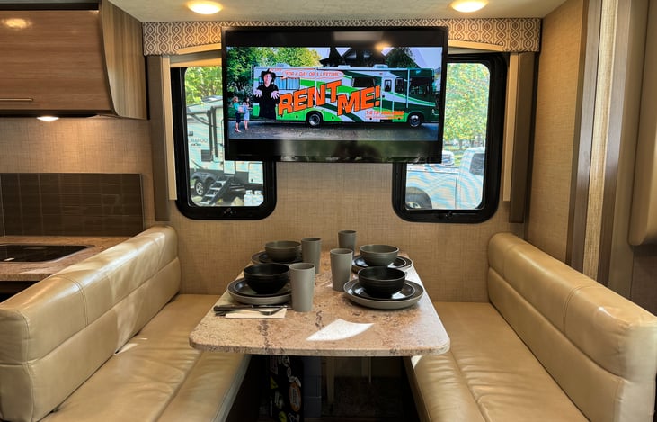 Dinette, with living room 40" TV. Two seatbelts located under rear seat (on left in photo).