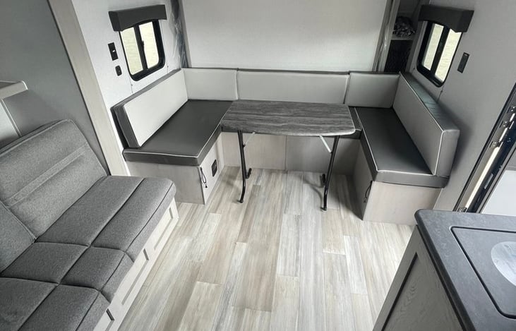 living area, dinette that folds down to a bed, sofa that folds into a bed