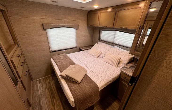 Master Queen Bed: Enjoy the comfort of a queen-sized bed in a private sleeping area, perfect for recharging after a day of adventure.