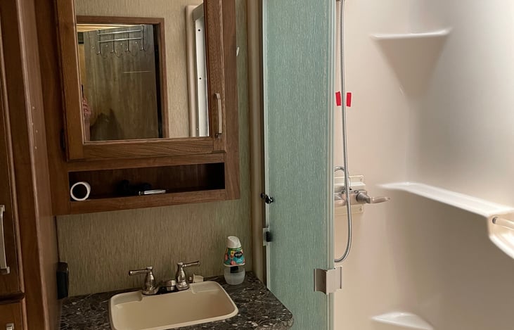 Bathroom with full shower.