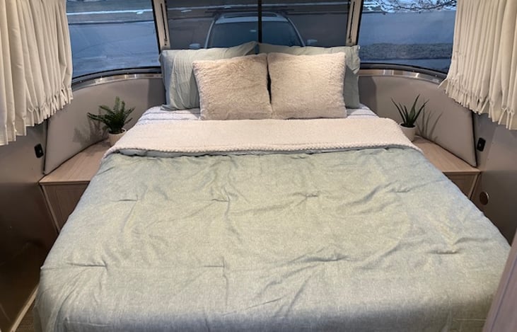 Queen bed with cooling mattress. All bedding included.