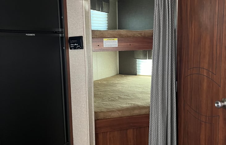 Sleeping areas, top and lower bunks. Great for kids, tight fit for adults. You don’t have room to sit up inside the bunks.
