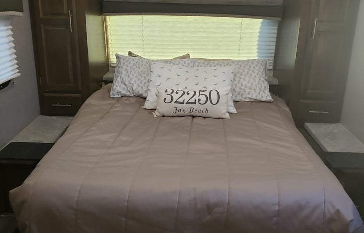 Murphy style queen bed.  With heated mattress for those chilly nights.  2 wardrobe closets and drawers for storage.