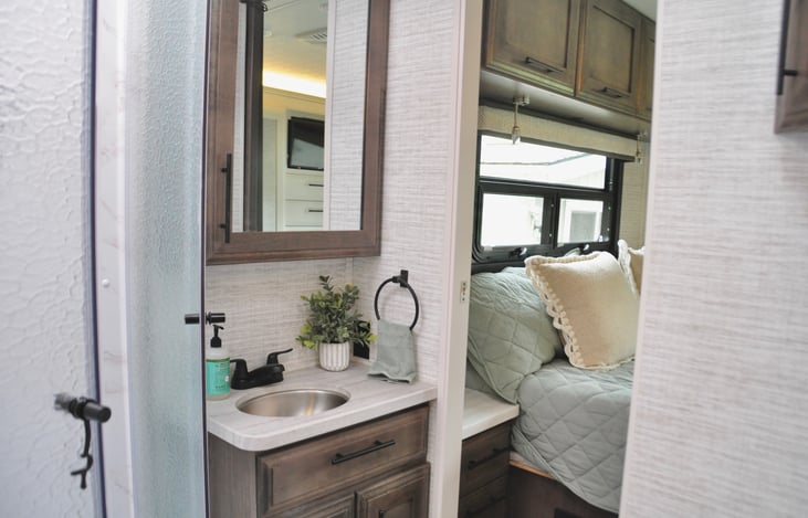 Bathroom with access from bedroom and main area