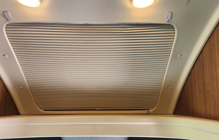 the Maru has a sunroof with this cover when not in use. i chose to not have a bed over the cab for easier handling. Makes her more aerodynamic. The rvs with the bed feels more like a freight truck.