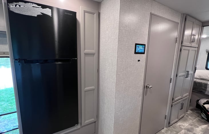 Large fridge with pantry next to it