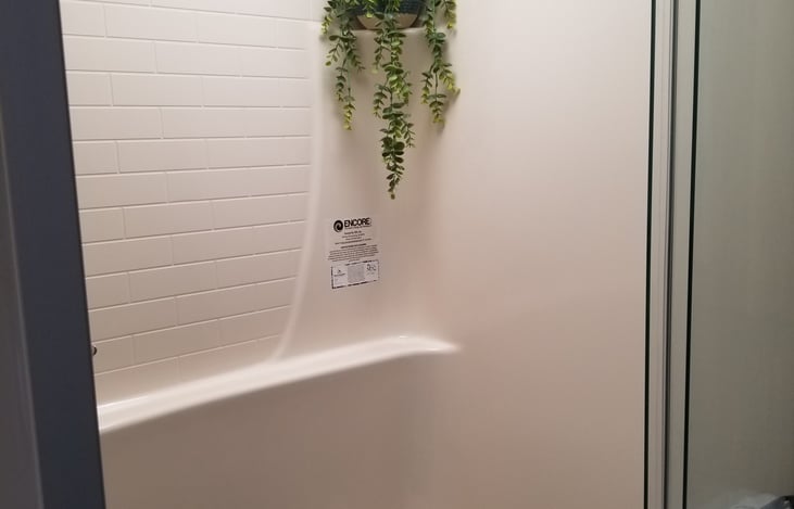 Large bath room with standup shower.