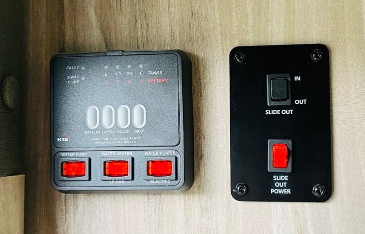 Gray/black tank, water heater, and slide controls