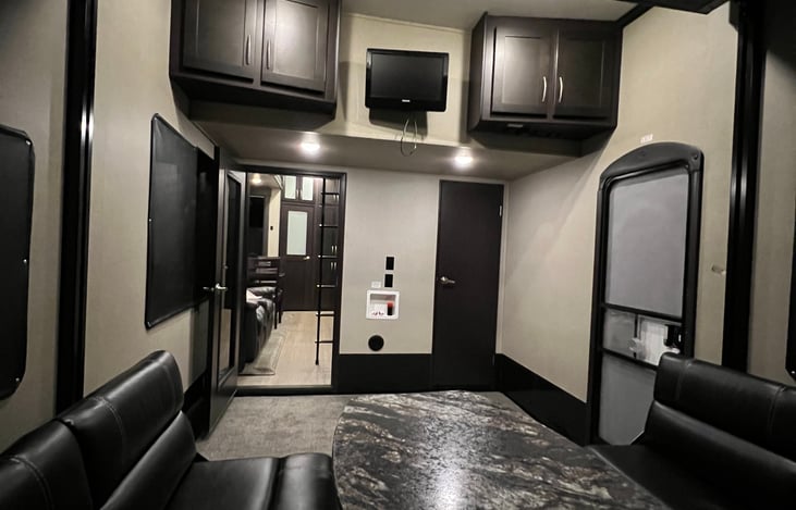 Garage portion of the camper; left door leads into living room / kitchen; right door leads into 1/2 bath