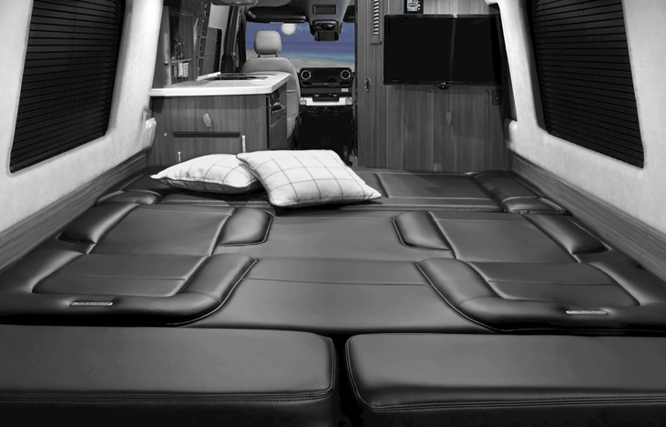 Couch folds down into bed with a push of a button