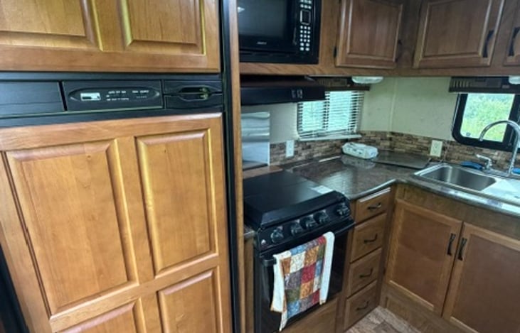 Kichen view with larger fridge