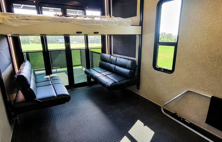 Garage sofas and overhead queen. Couches turn into one large bed and become bunk beds. They raise up to the ceiling for the garage to store all your toys.