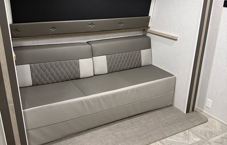 Back bedroom to the right. Small couch OR full bed with bunk above it.