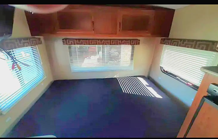 Rear dining table makes a queen sized bed