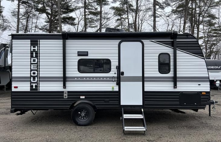 Exterior of the Keystone Hideout, highlighting its sleek design, slide-out, and spacious layout.