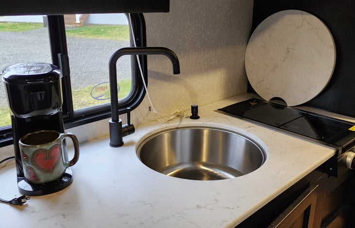 Kitchen counter, sink and 2 burner stove