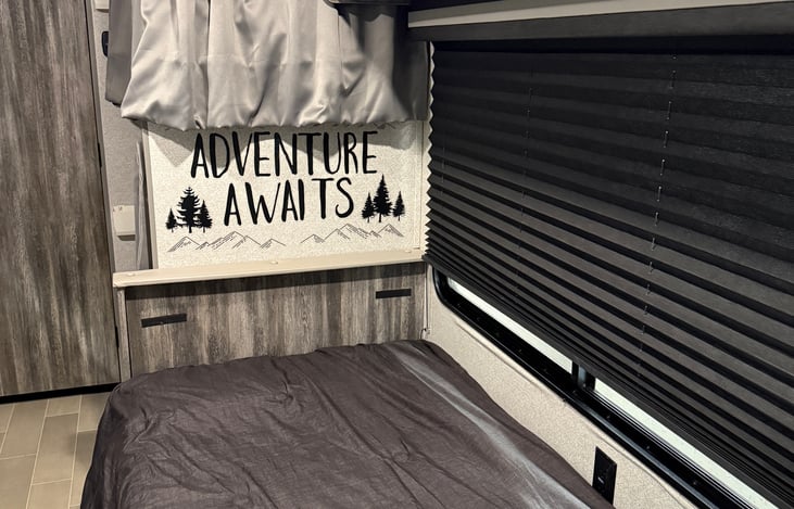 Table folds down into a bed for a 5th person to sleep.