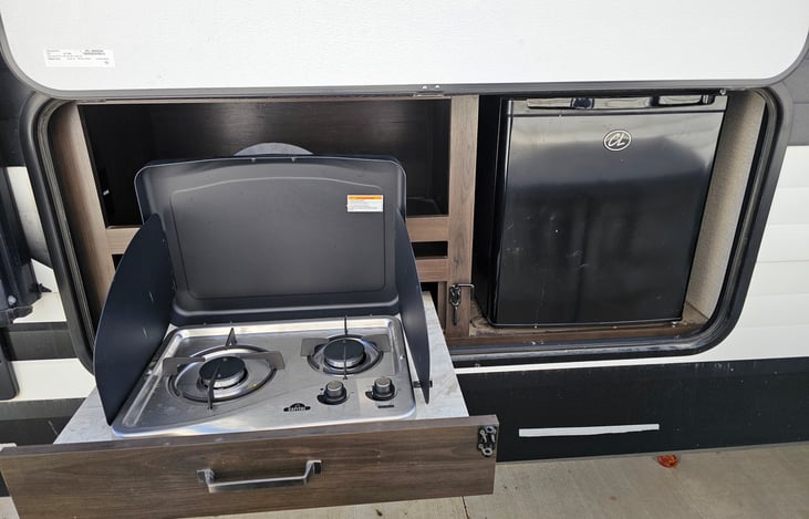 outside cook station and mini fridge. Fridge only works when hooked up to and outlet or generator.