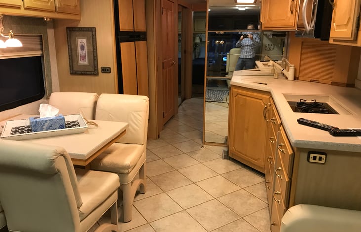 Kitchen/Sofa single slide out extended for reference. Plenty of walk-through space.  Dining table has leaf to extend.