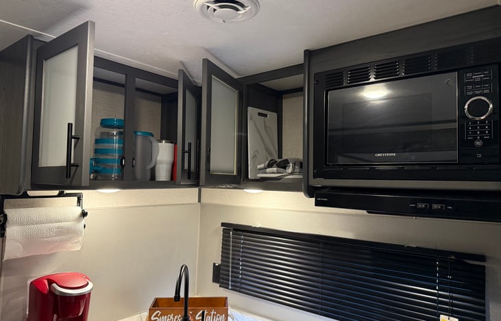 Stocked cabinets with plates, cups, bowls, tea pitchers, stainless cups, cutting board, trays, pizza stone, strainer, tablecloth. Need something else? Let us know!