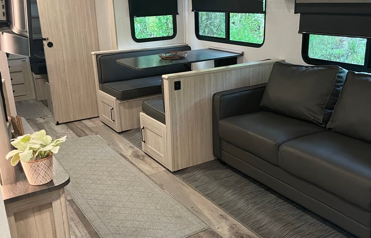 Hang out and have breakfast or sleep extra guests on the full sized pull out and kid sized dinette.