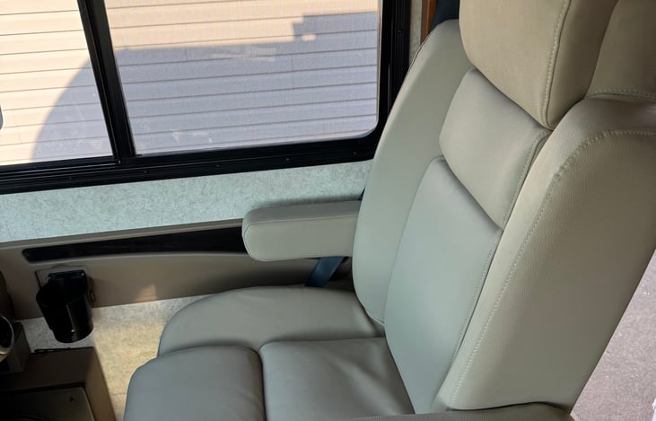 Passenger's seat. Turns backward for additional seating while parked.