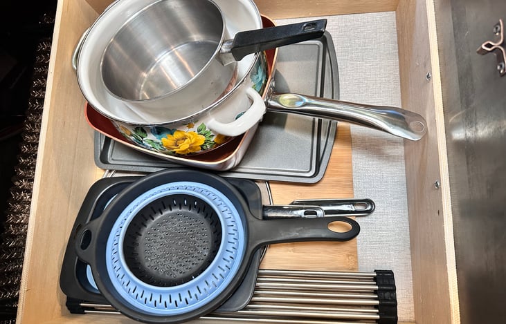 Pots, skillet, splatter screen for pots or skillet, cookie sheets, cutting board, over sink drying rack for dishes and Colanders