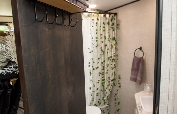 Bathroom With Tall Shower and Soft Cotton Towels