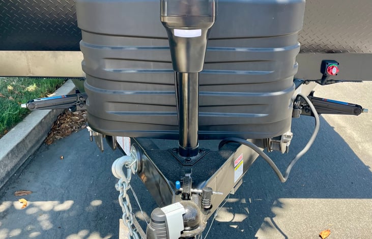 Electric trailer jack can also be manually raised or lowered with wrench located in the front storage bunk.