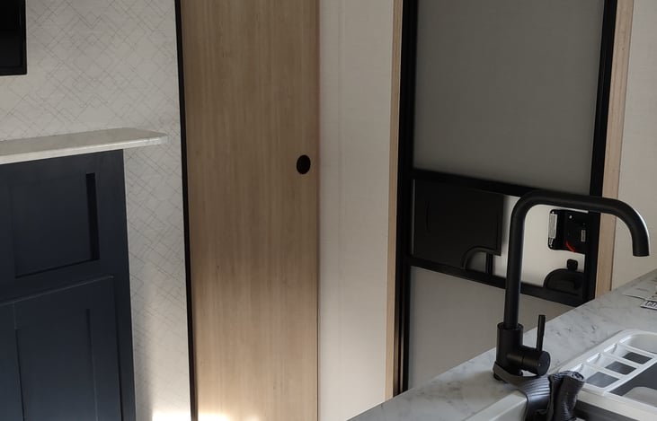 outer door and pocket door to queen bdrm