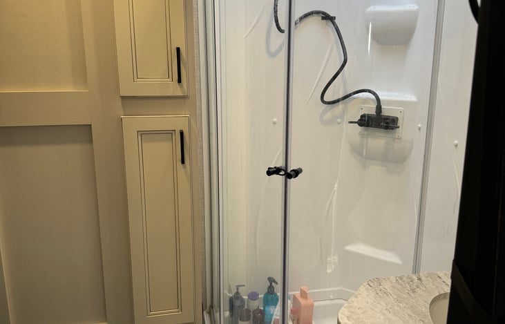 Full bathroom with a stand up shower. I’m 6’ and don’t have to crouch to shower!