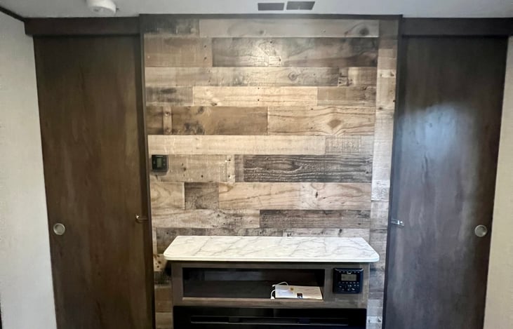 Gas Fireplace.  Behind is the bedroom