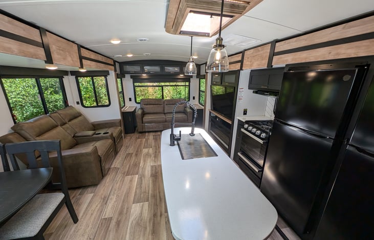 Huge open kitchen/living room with lots of windows and skylight! Excellent AC and heat, plus 4-season insulation for efficient comfort year round.