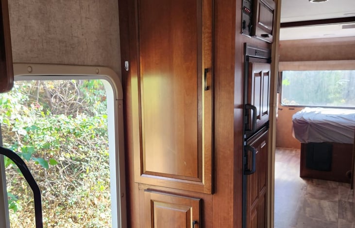 cabinet and fridge at entrance