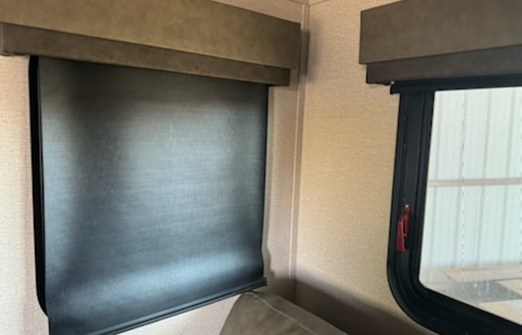 Roll down black-out blinds throughout unit