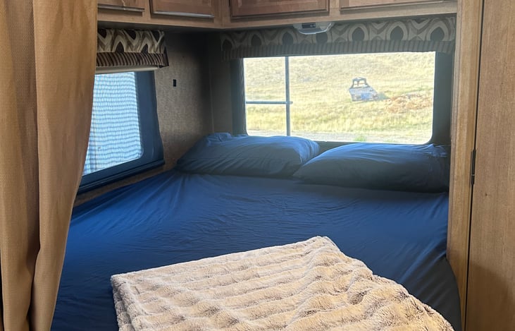 Back bed has comfortable mattress topper, standard linens and privacy curtain!