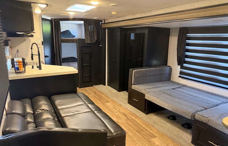 Sofa bed conversion and dinette sleeper conversion 2 bunk beds at end