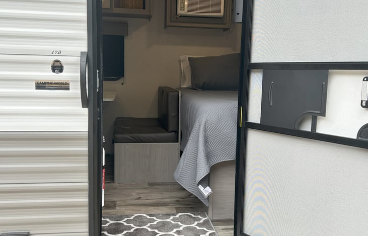 Entry door and step into The Kozy Kamper.