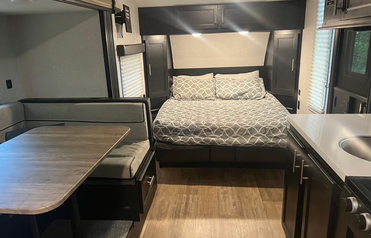 Queen bed extended (includes added 2" memory foam topper for extra cozy RV sleeping)