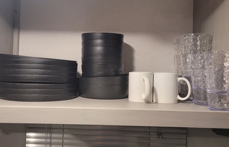 plenty of plates and bowls , 2 coffee cups