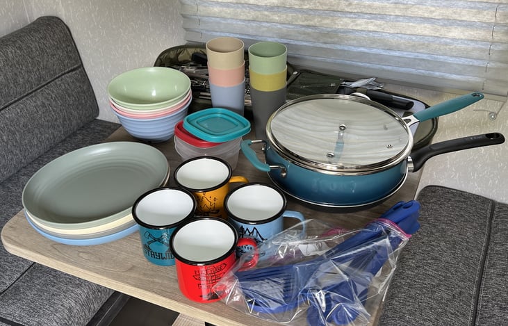 Provided dining ware, pot/pan, cooking utensils and silverware.