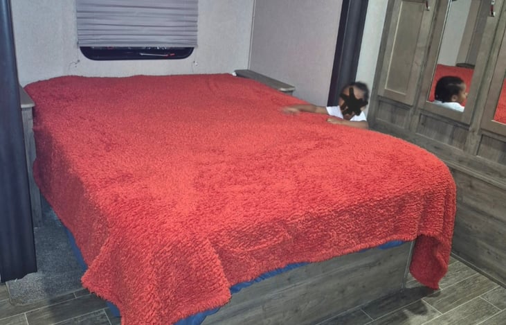 Master bedroom with queen bed, closet, Seperate ac and TV.